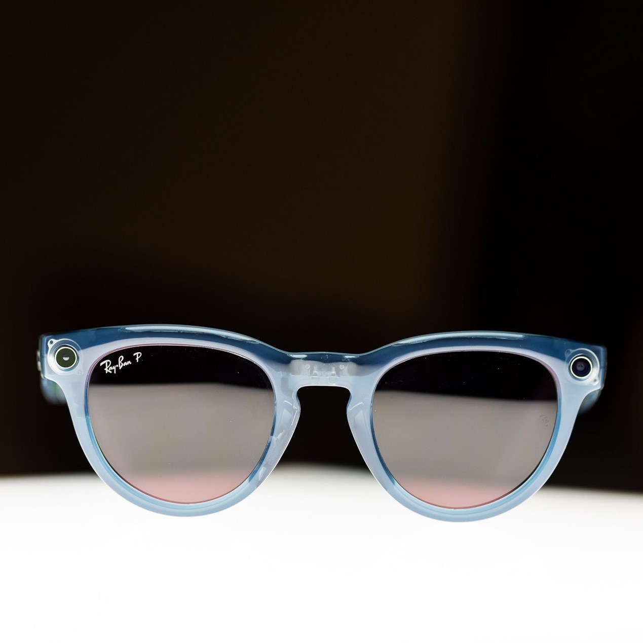 Close-up of Ray-Ban Meta smart glasses on an illuminated surface